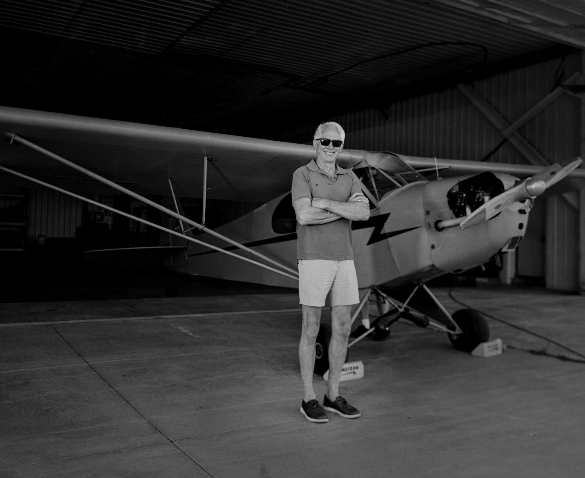 Pilot standing with an aircraft